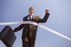 Businessman Crossing the Finish Line